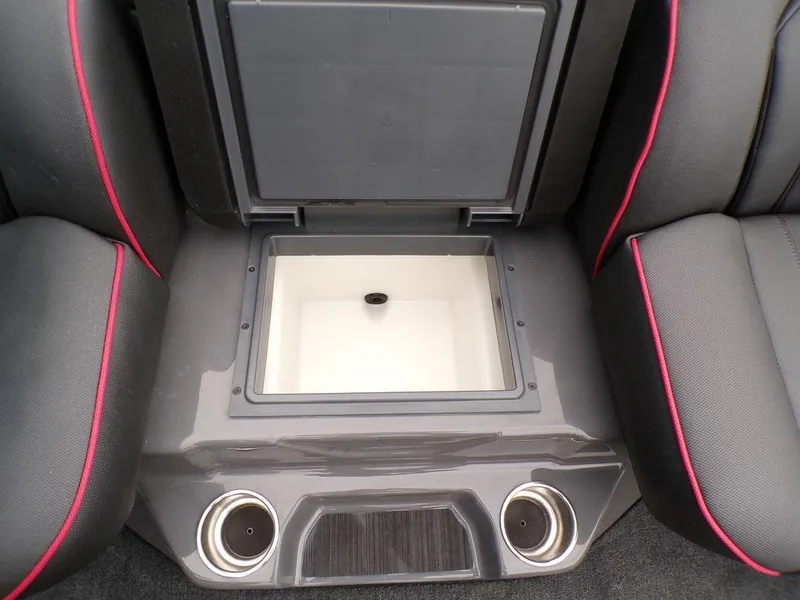 Slide: The Image of 2025 Skeeter ZXR21 boat interior with storage compartment and cup holders. - 17