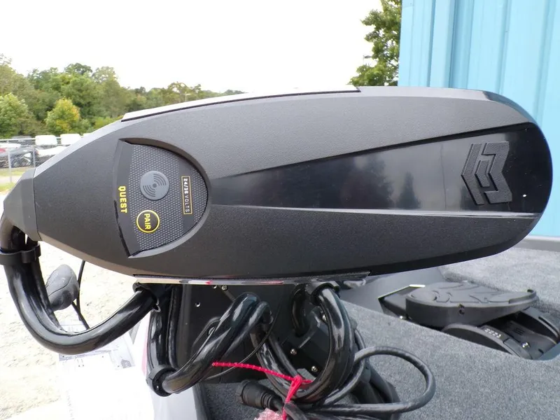 Slide: The Image of 2025 Skeeter ZXR21 boat motor, close-up view with control panel and cables. - 2