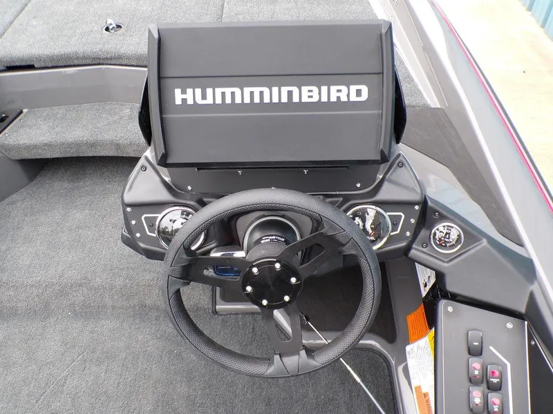 Slide: The Image of 2025 Skeeter ZXR21 boat dashboard with Humminbird display and steering wheel. - 22