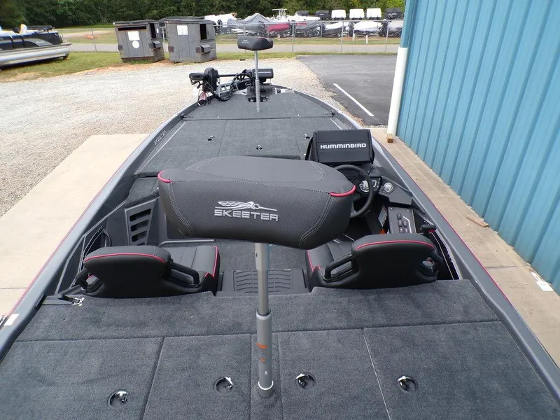 Slide: The Image of 2025 Skeeter ZXR21 boat interior with Humminbird electronics, featuring spacious seating and modern design. - 8