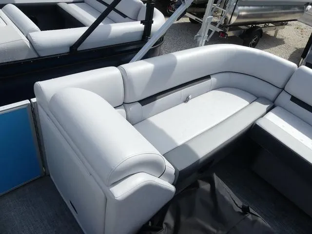 Slide: The Image of Sweetwater SW2286QS 2025 pontoon boat with white cushioned seating. - 11