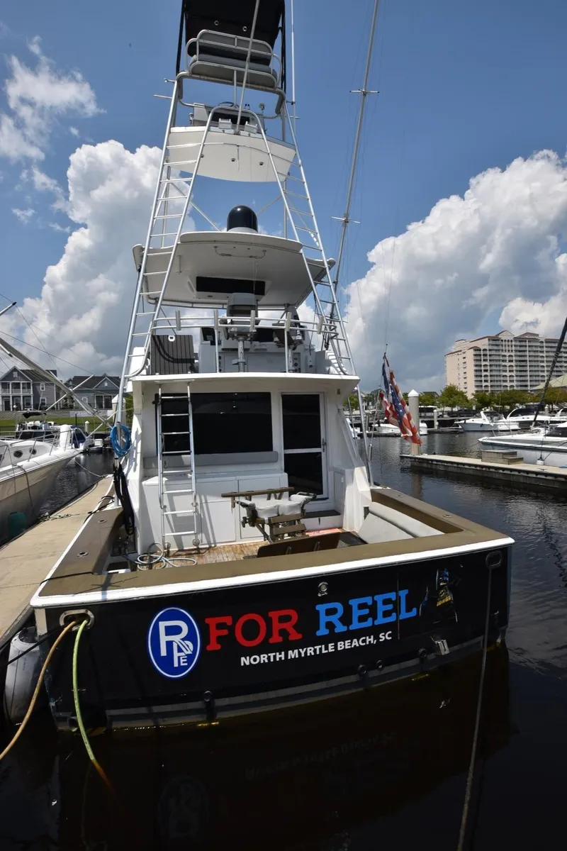 Slide: The Image of 1997 Viking 50 Convertible boat docked in North Myrtle Beach, SC marina. - 2