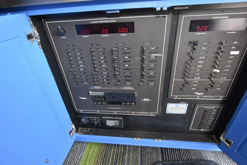 Slide: The Image of Electrical control panel on a 1997 Viking 50 Convertible boat. - 25