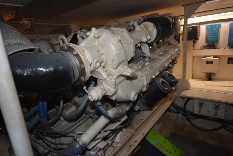 Slide: The Image of Engine room of a 1997 Viking 50 Convertible yacht, showcasing detailed machinery. - 30