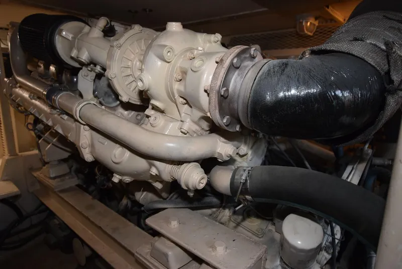 Slide: The Image of Engine of a 1997 Viking 50 Convertible boat, showcasing intricate mechanical components. - 31