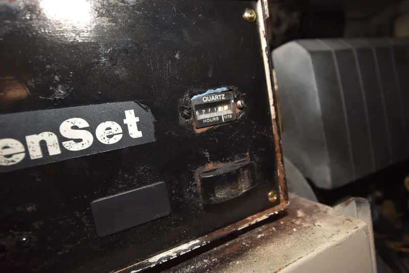Slide: The Image of Hour meter on a 1997 Viking 50 Convertible engine set, showing 1110 hours. - 32