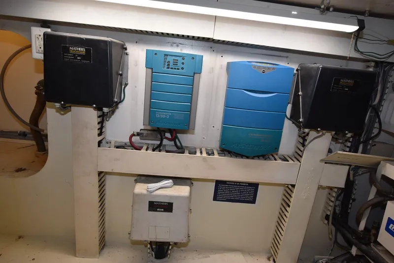Slide: The Image of Electrical equipment inside a 1997 Viking 50 Convertible boat. - 35