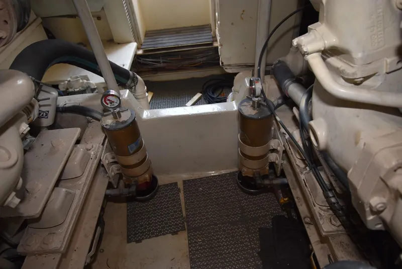 Slide: The Image of Engine room of a 1997 Viking 50 Convertible yacht, showcasing mechanical components. - 38