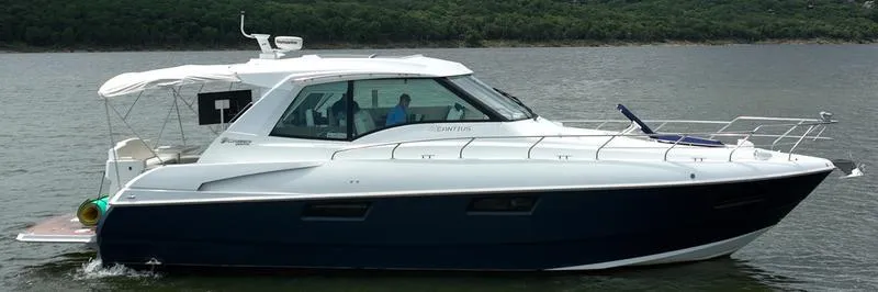 Slide: The Image of 2011 Cruisers Yachts 48 Cantius on calm water, side view. - 16