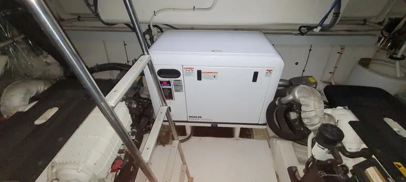 Slide: The Image of Engine room of 2011 Cruisers Yachts 48 Cantius with generator and machinery. - 26