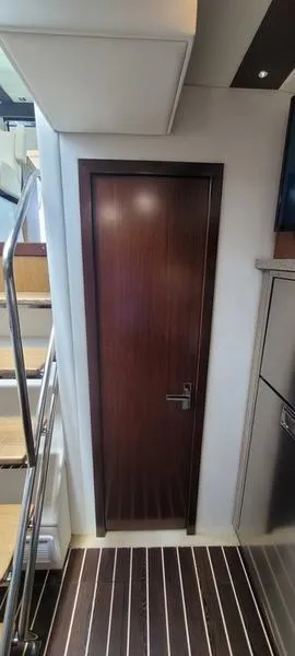 Slide: The Image of Interior of 2011 Cruisers Yachts 48 Cantius with wooden door and modern design. - 37