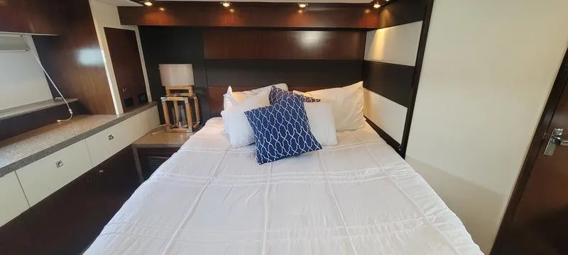 Slide: The Image of Luxurious bedroom interior of 2011 Cruisers Yachts 48 Cantius with modern design and cozy bedding. - 40