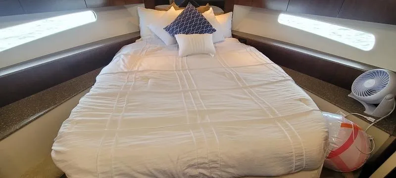Slide: The Image of Luxurious bedroom interior of 2011 Cruisers Yachts 48 Cantius with elegant bedding. - 43