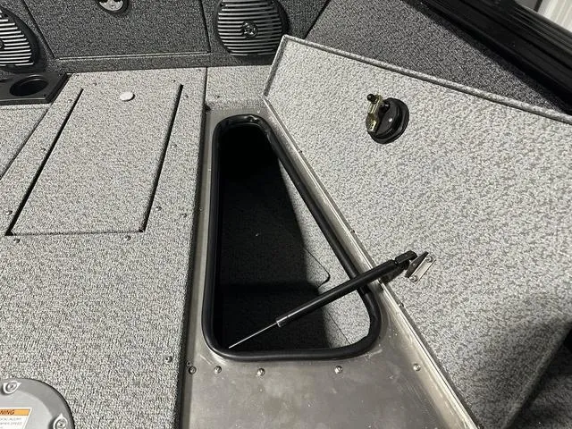 Slide: The Image of 2025 Lund 1775 Impact XS Sport boat interior storage compartment. - 22