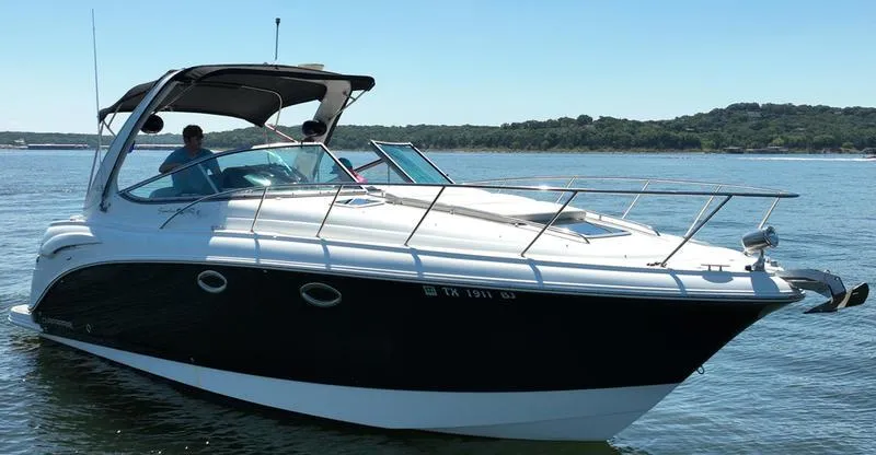 Slide: The Image of 2009 Chaparral 310 Signature boat on a serene lake. - 10