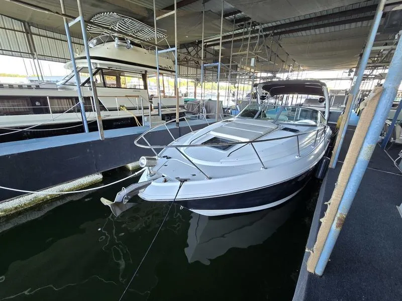 Slide: The Image of 2009 Chaparral 310 Signature boat docked in marina. - 12