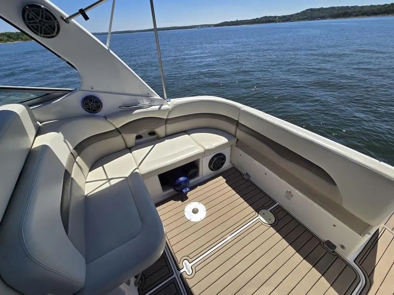 Slide: The Image of 2009 Chaparral 310 Signature boat interior with seating, overlooking calm water. - 13