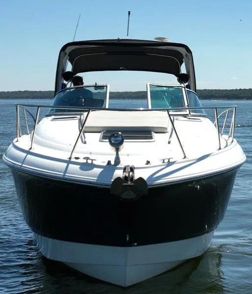 Slide: The Image of 2009 Chaparral 310 Signature boat on calm water, front view. - 14