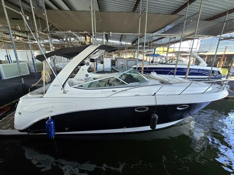Slide: The Image of 2009 Chaparral 310 Signature boat docked in a marina. - 17