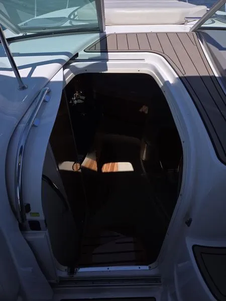 Slide: The Image of 2009 Chaparral 310 Signature boat cabin entrance with wooden flooring. - 18
