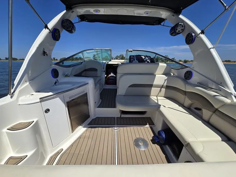 Slide: The Image of 2009 Chaparral 310 Signature boat interior with seating and modern amenities. - 22