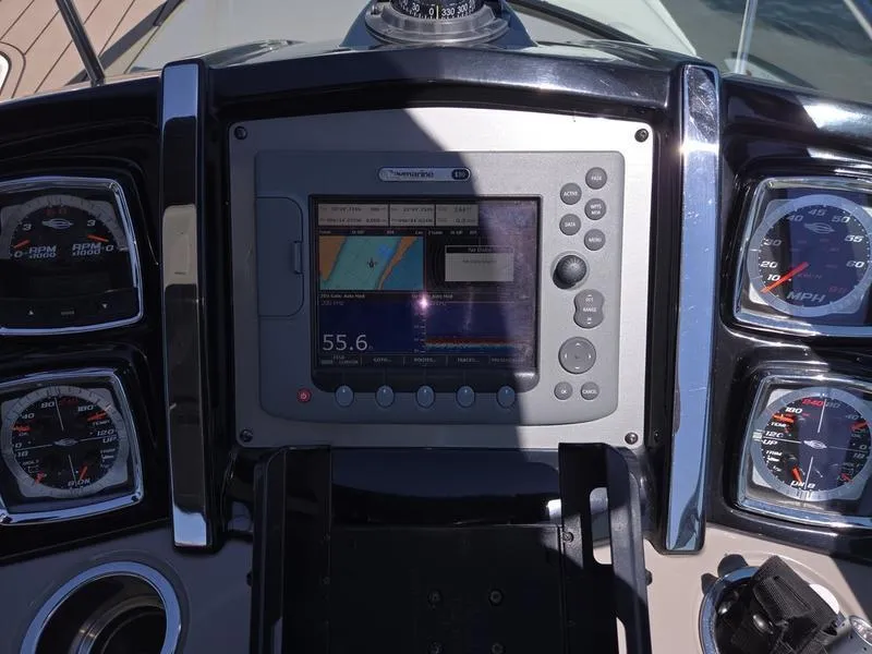 Slide: The Image of Dashboard of 2009 Chaparral 310 Signature boat with navigation system and gauges. - 24