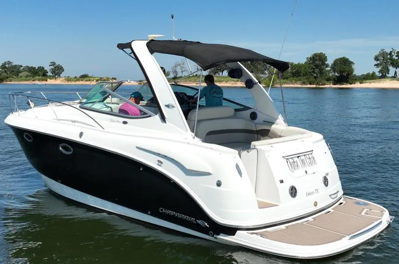 Slide: The Image of 2009 Chaparral 310 Signature boat cruising on a sunny day. - 25