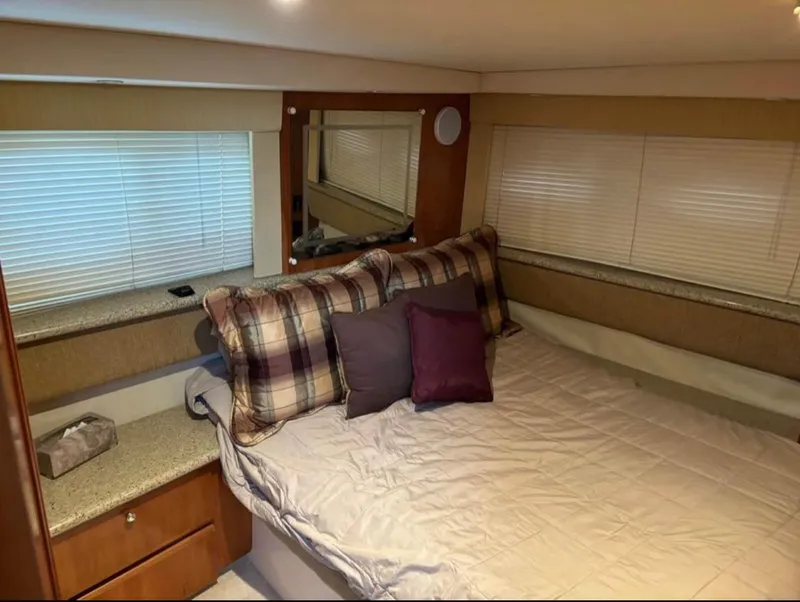 Slide: The Image of Interior cabin of 2001 Carver 356 Motor Yacht with bed and pillows. - 22