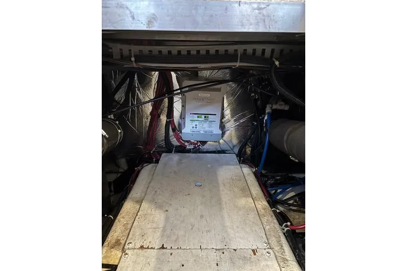 Slide: The Image of Engine room of 2001 Carver 356 Motor Yacht with electrical components and wiring. - 30