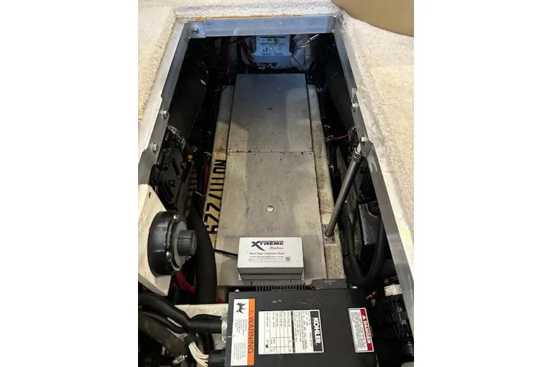 Slide: The Image of Engine compartment of 2001 Carver 356 Motor Yacht, featuring mechanical components and wiring. - 31