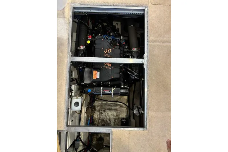 Slide: The Image of Engine compartment of a 2001 Carver 356 Motor Yacht, showcasing mechanical components. - 34