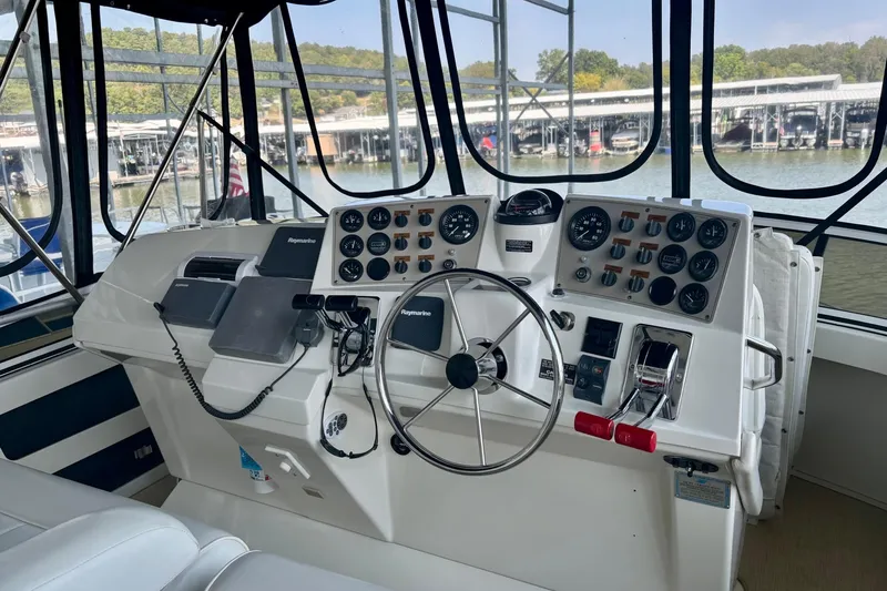 Slide: The Image of Helm of 2001 Carver 356 Motor Yacht with navigation instruments and steering wheel. - 36