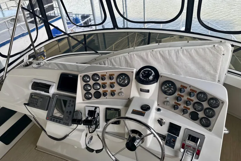 Slide: The Image of Control panel of a 2001 Carver 356 Motor Yacht with gauges and navigation equipment. - 39