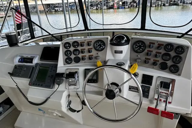 Slide: The Image of Helm of 2001 Carver 356 Motor Yacht with steering wheel and navigation instruments. - 7