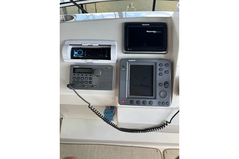 Slide: The Image of Control panel of a 2001 Carver 356 Motor Yacht with navigation and communication equipment. - 8