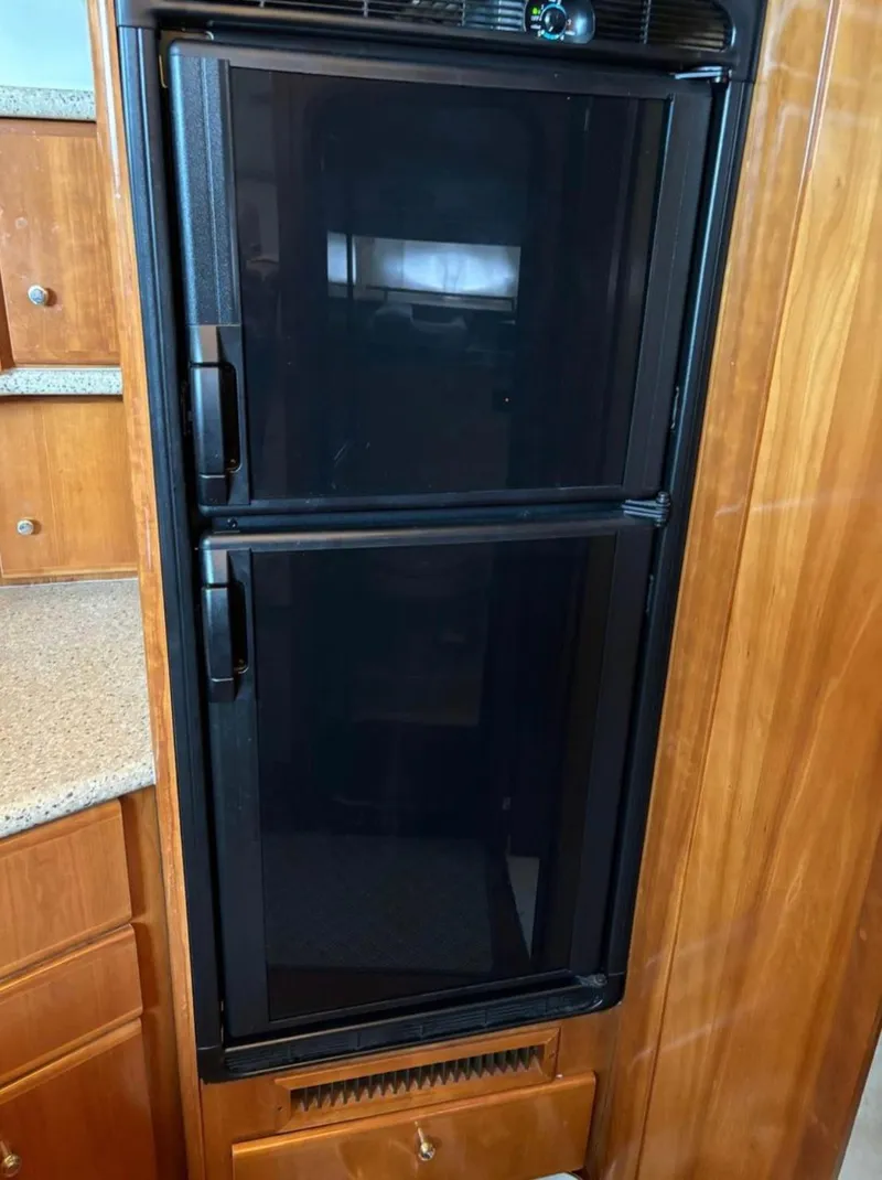 Slide: The Image of Black refrigerator in 2001 Carver 356 Motor Yacht kitchen area. - 17