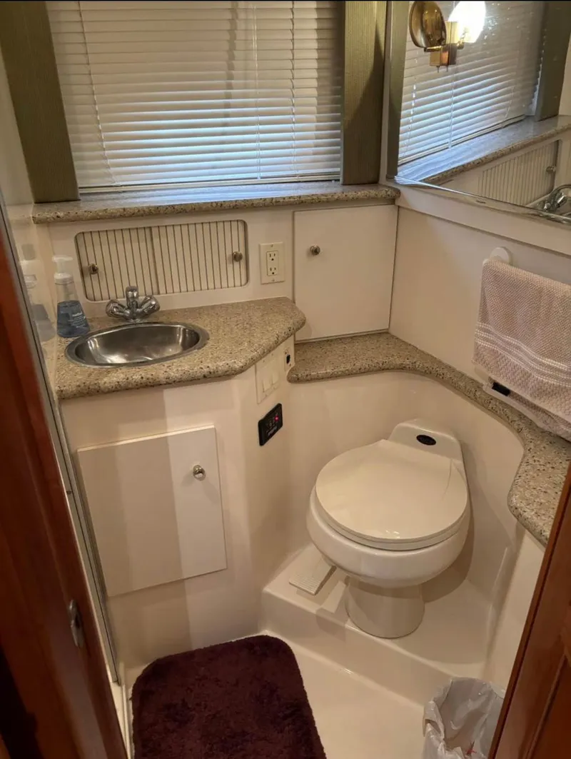 Slide: The Image of 2001 Carver 356 Motor Yacht bathroom with sink, toilet, and granite countertop. - 20
