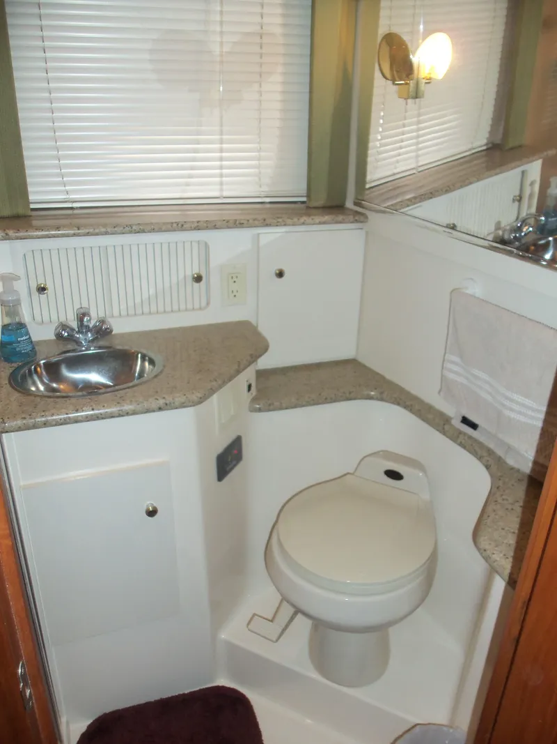 Slide: The Image of Bathroom interior of 2001 Carver 356 Motor Yacht with sink and toilet. - 23