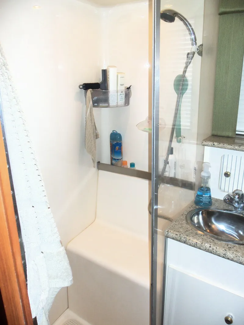 Slide: The Image of Bathroom in 2001 Carver 356 Motor Yacht with shower and sink. - 24