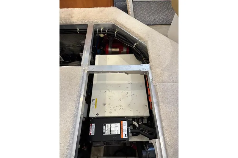 Slide: The Image of Engine compartment of a 2001 Carver 356 Motor Yacht, showcasing mechanical components. - 32