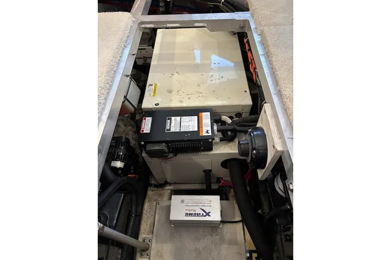 Slide: The Image of Engine compartment of a 2001 Carver 356 Motor Yacht, showcasing mechanical components. - 33