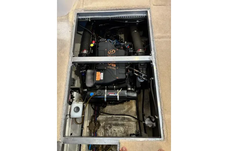 Slide: The Image of Engine compartment of a 2001 Carver 356 Motor Yacht, featuring a V8 engine. - 35