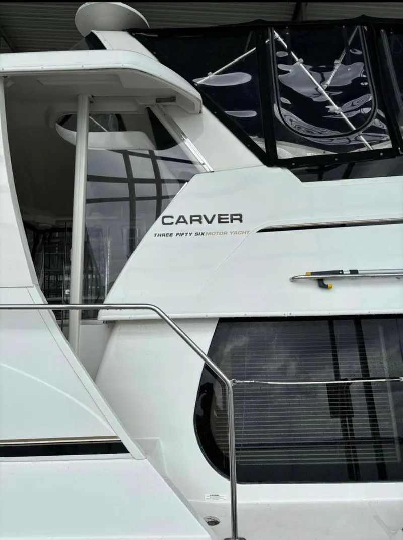 Slide: The Image of 2001 Carver 356 Motor Yacht, side view, showcasing sleek design and branding. - 5
