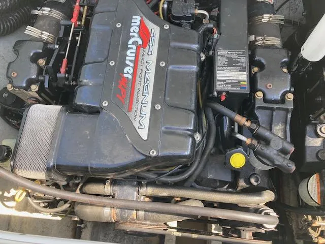 Slide: The Image of Engine of a 1996 Baja 320 boat, featuring a MerCruiser 454 Magnum. - 8