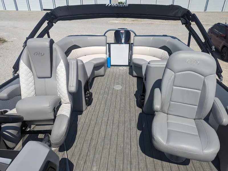 Slide: The Image of 2022 Manitou Encore 25 RF pontoon boat with luxurious gray seating and spacious deck. - 12