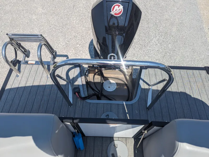 Slide: The Image of 2022 Manitou Encore 25 RF boat deck with motor and seating area. - 14