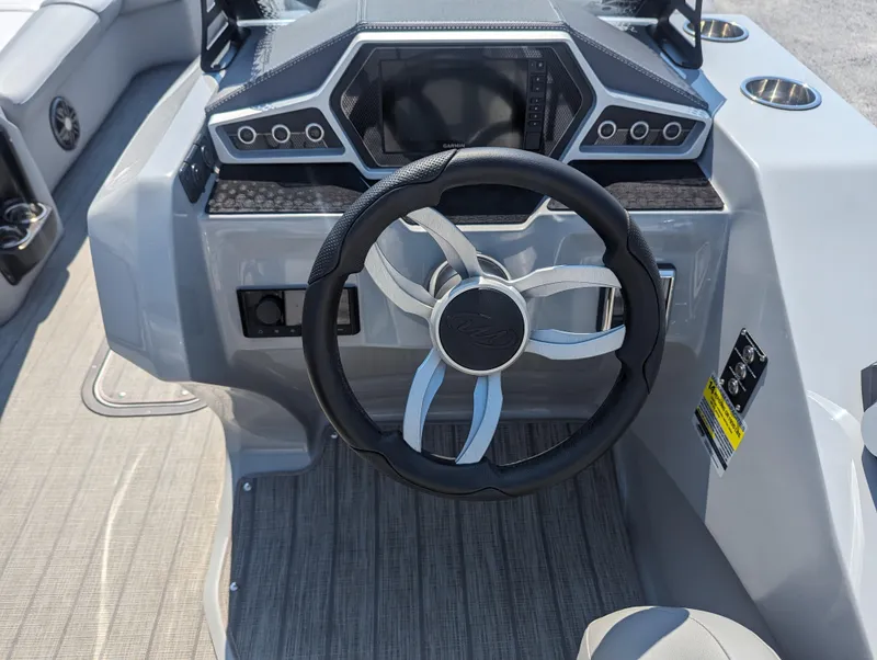 Slide: The Image of Steering console of 2022 Manitou Encore 25 RF boat with modern dashboard design. - 18