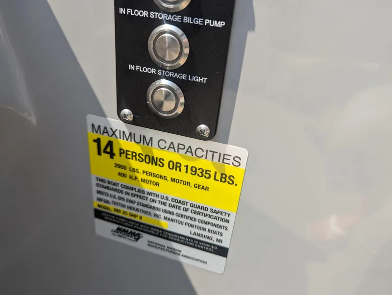 Slide: The Image of Capacity label on 2022 Manitou Encore 25 RF, max 14 persons or 1,935 lbs. - 20