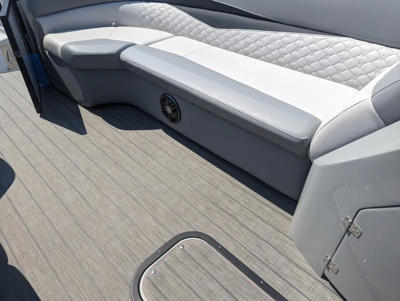 Slide: The Image of 2022 Manitou Encore 25 RF interior with gray seating and textured flooring. - 25