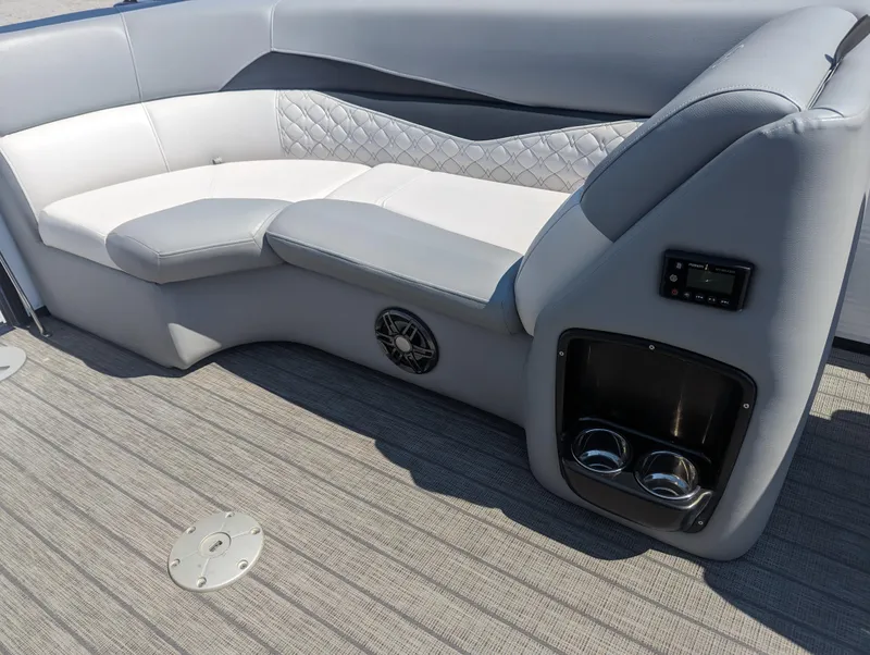 Slide: The Image of Luxurious seating on 2022 Manitou Encore 25 RF pontoon boat with cup holders and speaker. - 28